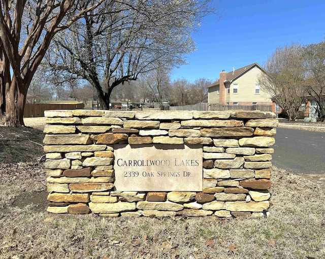 community sign with fence