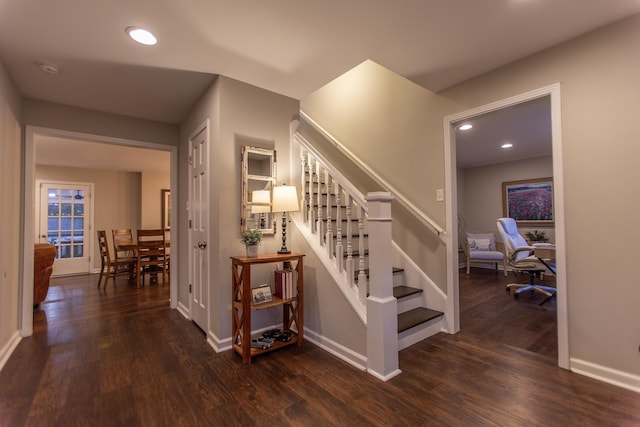 stairway with recessed lighting, baseboards, and wood finished floors