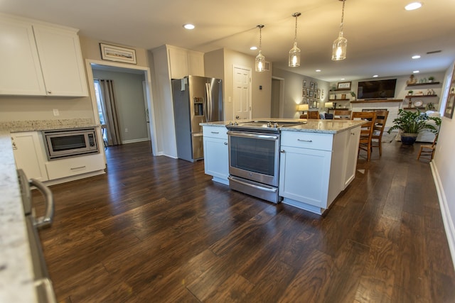 kitchen featuring white cabinetry, dark wood finished floors, open floor plan, and stainless steel appliances