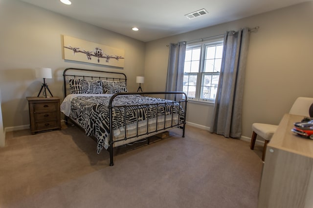 carpeted bedroom with recessed lighting, baseboards, and visible vents