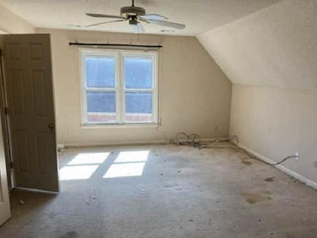 bonus room featuring vaulted ceiling and ceiling fan