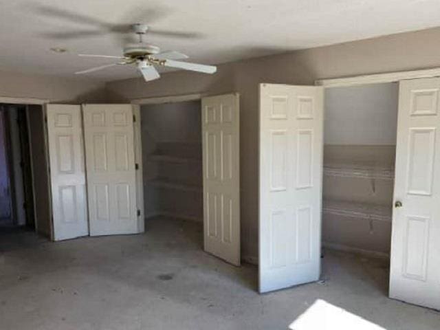 unfurnished bedroom featuring unfinished concrete floors