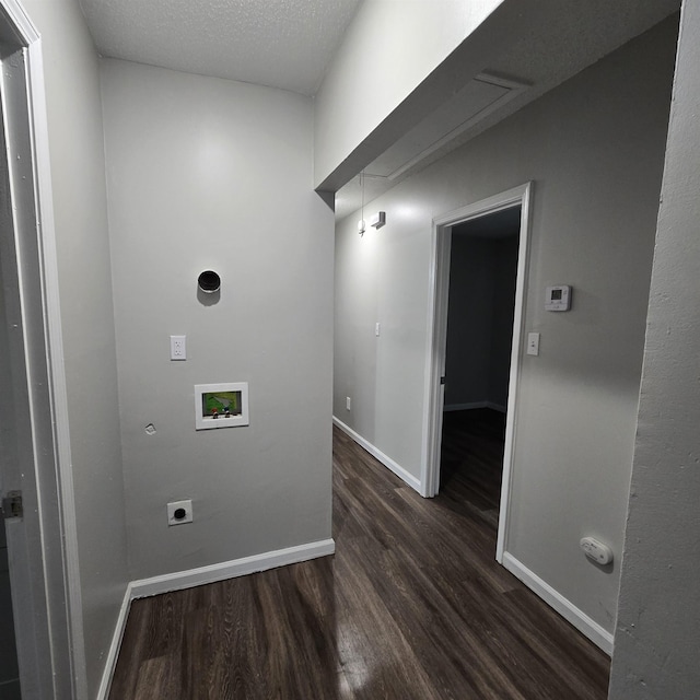 clothes washing area featuring dark wood-type flooring, hookup for a washing machine, baseboards, and electric dryer hookup