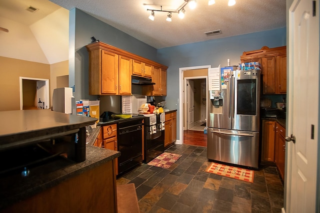 kitchen with dark countertops, visible vents, stainless steel refrigerator with ice dispenser, and black dishwasher