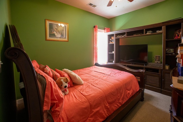 carpeted bedroom featuring visible vents and ceiling fan