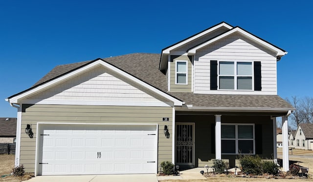 view of front of property featuring covered porch, an attached garage, concrete driveway, and roof with shingles