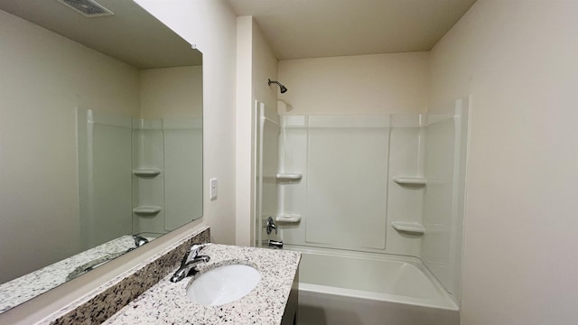 full bath with washtub / shower combination, visible vents, and vanity