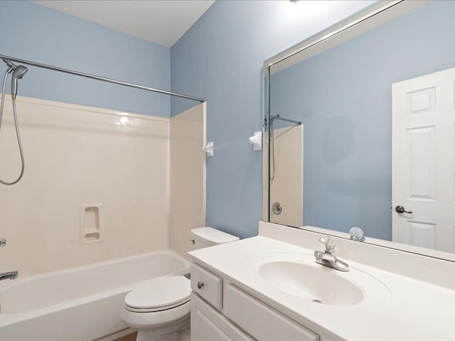 bathroom with vanity,  shower combination, and toilet