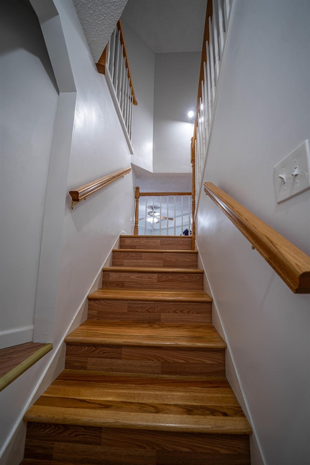 stairs featuring baseboards