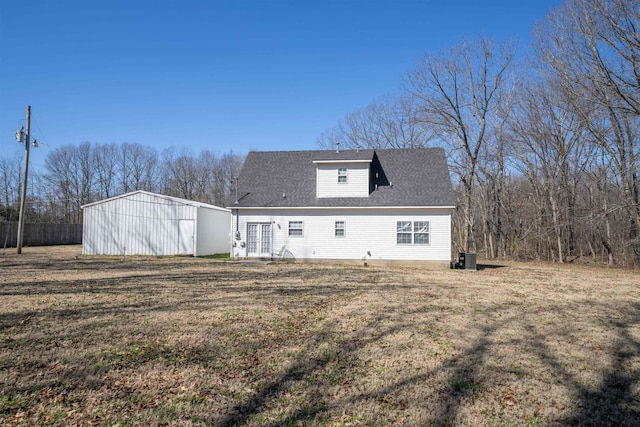 back of house featuring french doors, a yard, and central AC