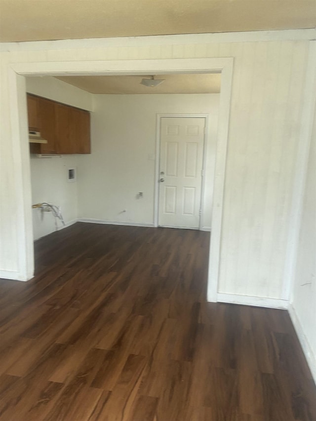 empty room with dark wood-type flooring