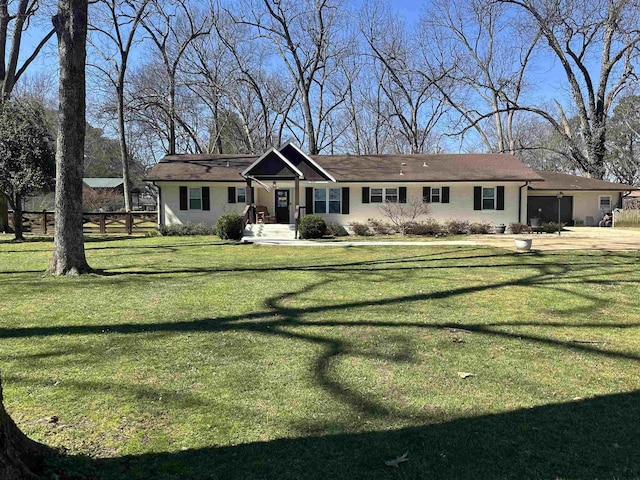 ranch-style house with a front lawn