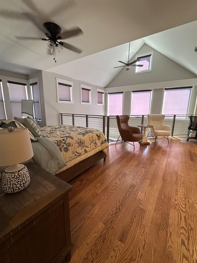 bedroom featuring ceiling fan, lofted ceiling, and wood finished floors