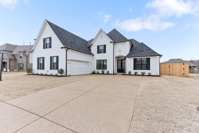 view of front of home featuring concrete driveway and a garage