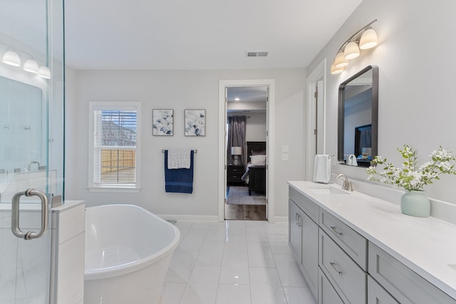 bathroom with a freestanding tub, visible vents, a stall shower, ensuite bathroom, and vanity