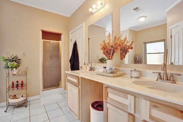 full bath with tile patterned floors, visible vents, crown molding, and a sink