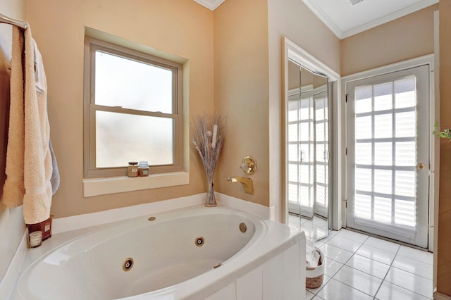 full bath with tile patterned floors, a jetted tub, and ornamental molding