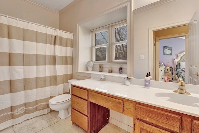 bathroom with tile patterned flooring, toilet, a shower with shower curtain, ornamental molding, and vanity