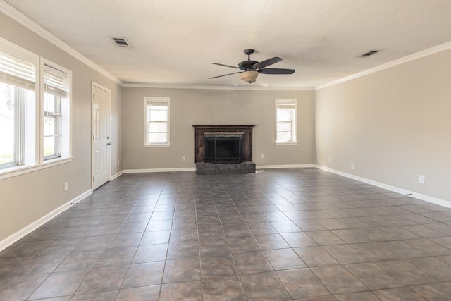 unfurnished living room with plenty of natural light, visible vents, a high end fireplace, and ornamental molding