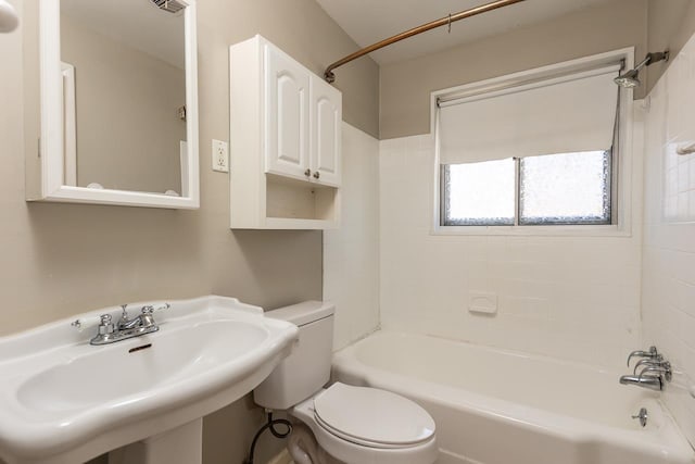 full bathroom with toilet,  shower combination, and a sink