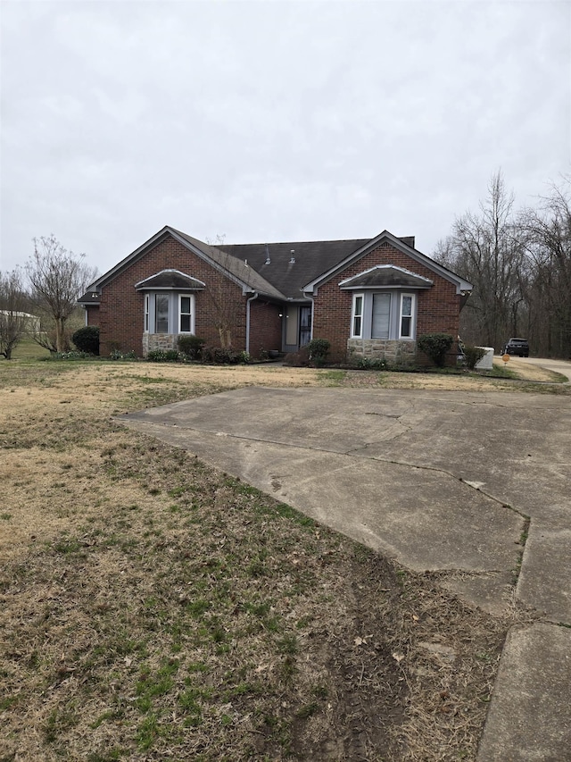 ranch-style house with brick siding