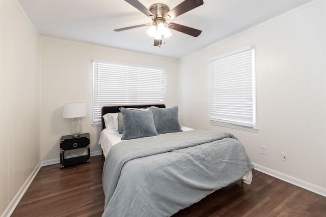 bedroom featuring crown molding, wood finished floors, baseboards, and ceiling fan