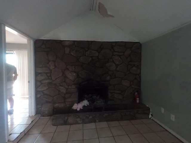 interior details with a stone fireplace