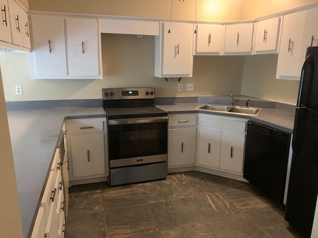 kitchen featuring a sink, black appliances, and white cabinets