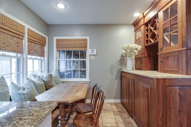 dining space with light tile patterned floors, recessed lighting, and baseboards