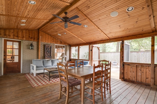 interior space featuring ceiling fan, wood ceiling, and lofted ceiling