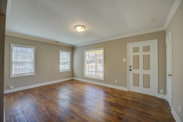 unfurnished room featuring baseboards, dark wood-style floors, and crown molding