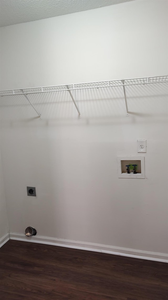 washroom featuring washer hookup, laundry area, baseboards, hookup for an electric dryer, and dark wood-style flooring