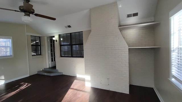 interior space featuring wood finished floors, a healthy amount of sunlight, and visible vents