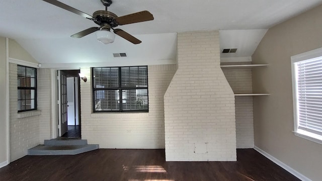 unfurnished room with wood finished floors, visible vents, and a healthy amount of sunlight