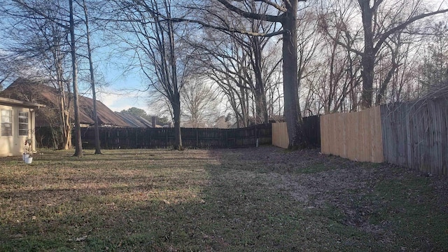 view of yard with a fenced backyard