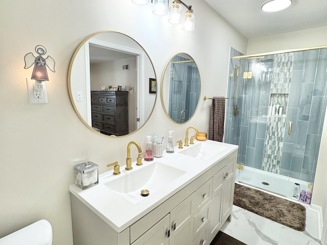 bathroom featuring a shower stall, toilet, marble finish floor, and a sink