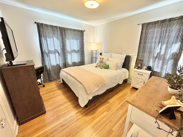 bedroom with light wood-style floors