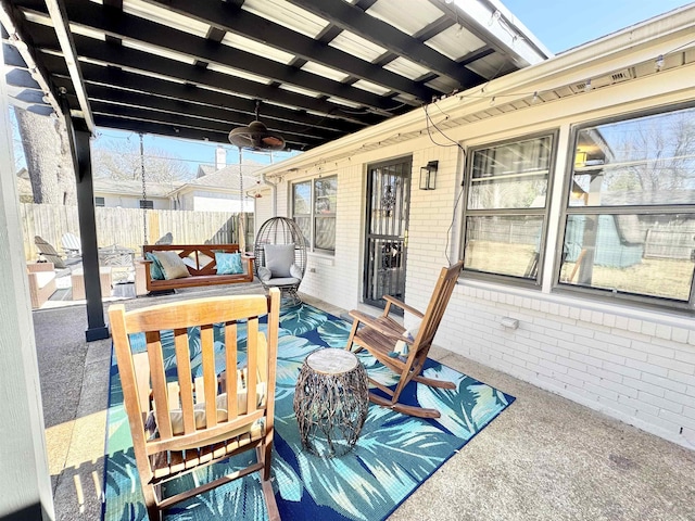 view of patio / terrace featuring fence