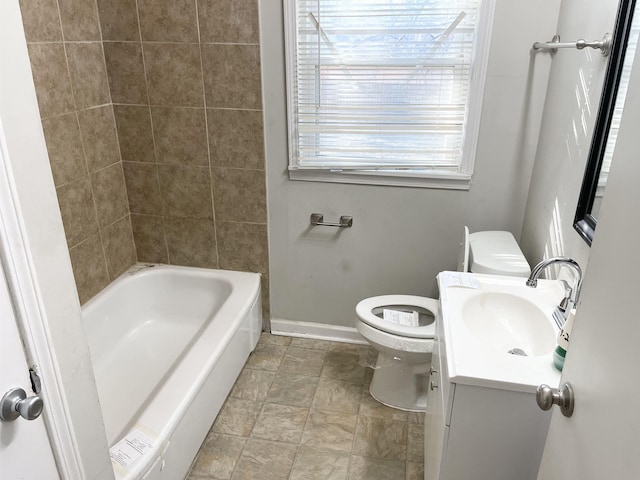 full bathroom with vanity, toilet, and baseboards