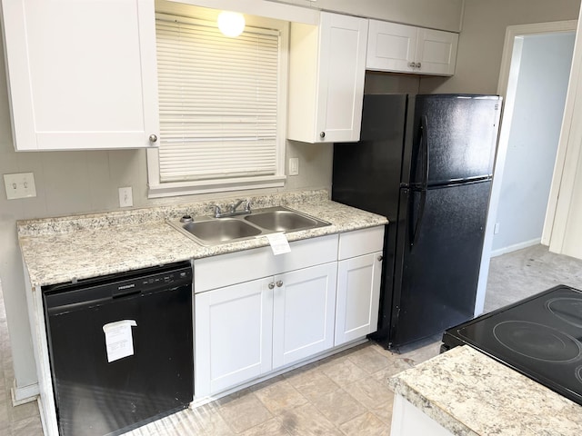 kitchen with black appliances, white cabinets, light countertops, and a sink