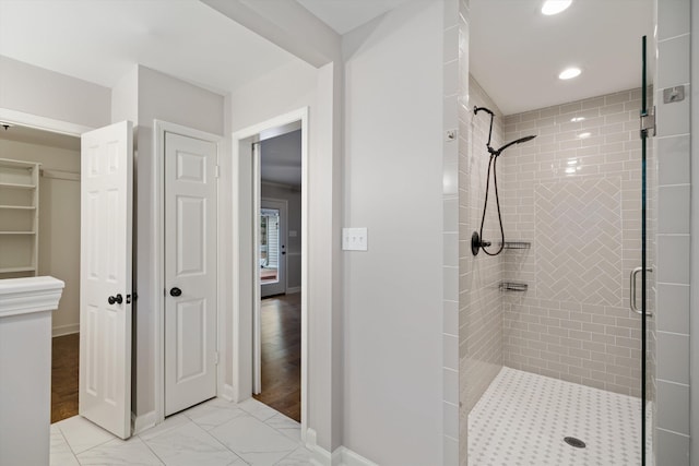 full bath featuring recessed lighting, baseboards, marble finish floor, and a shower stall