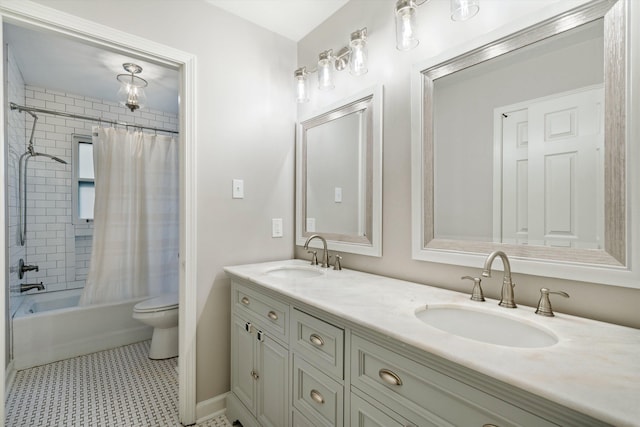 full bathroom with double vanity, shower / tub combo, toilet, and a sink