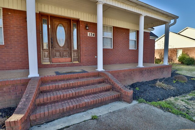 134 Willow Creek Dr, Ripley, TN 38063 - view of exterior entry featuring a porch and brick siding
