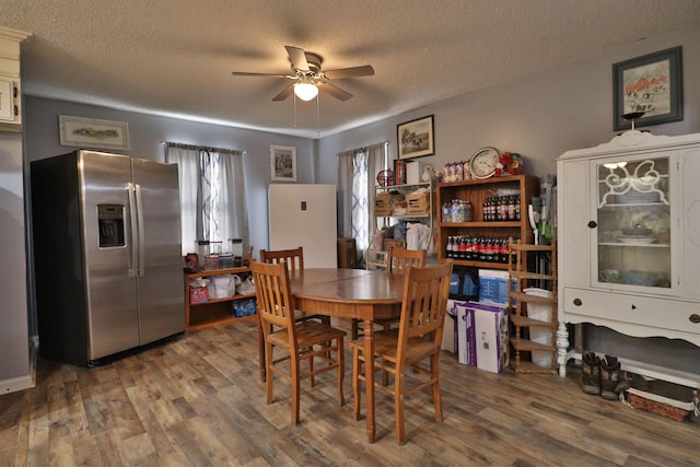 134 Willow Creek Dr, Ripley, TN 38063 - dining space with a textured ceiling, wood finished floors, and a ceiling fan