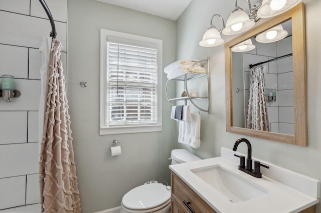 bathroom with vanity, a shower with shower curtain, and toilet