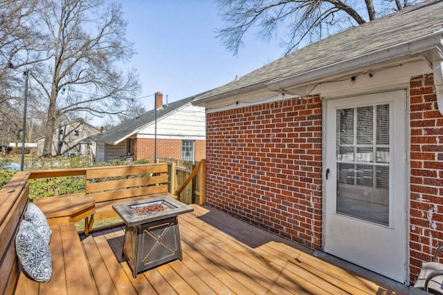 deck featuring an outdoor fire pit