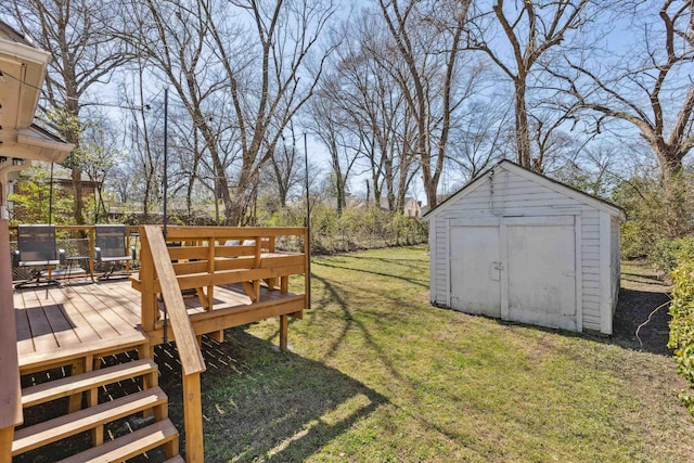 view of yard with a storage unit, an outbuilding, and a deck