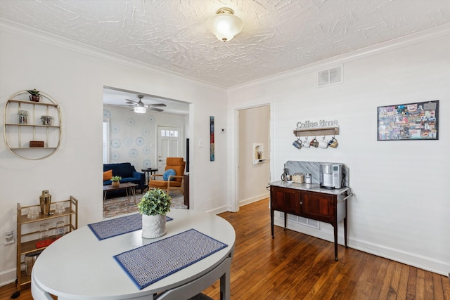 dining space featuring visible vents, baseboards, and hardwood / wood-style floors