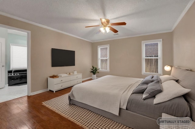 bedroom featuring multiple windows, wood finished floors, and ornamental molding