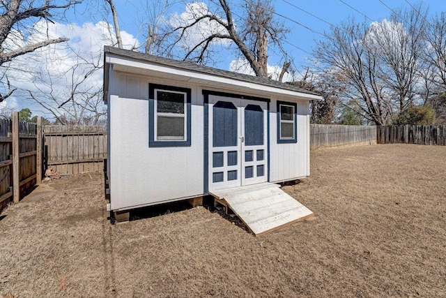 view of shed featuring a fenced backyard